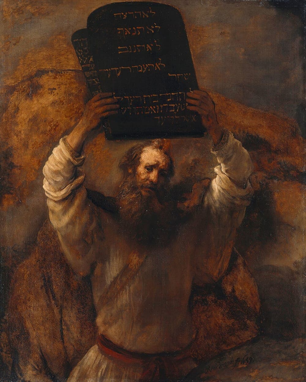 Rembrandt's Moses with the Ten Commandments: Moses raises two stone tablets inscribed in Hebrew above his head